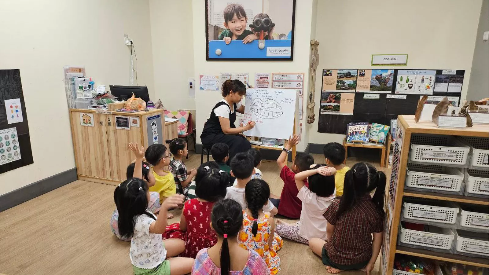 Educators-In-The-News-InSP-MAIN An educator instructs a group of children in an inclusive classroom setting, promoting collaboration and understanding.