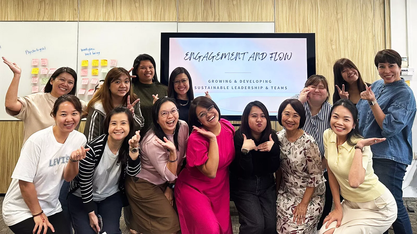 EC leaders pose for a group photo while attending an IBAP class on employee engagement and workplace well-being.