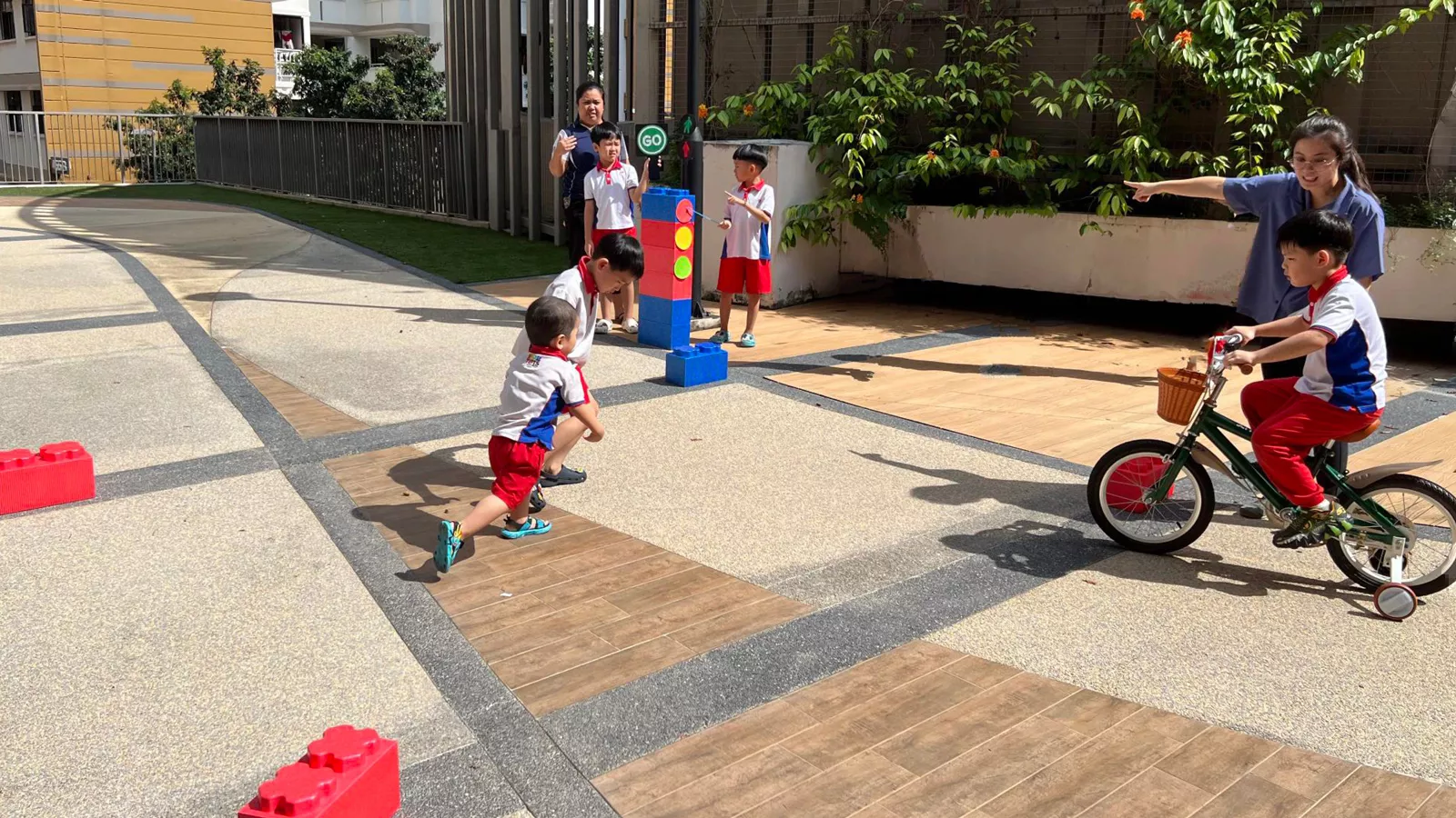 Children of all needs and abilities engage in an outdoor play activity together at their inclusive preschool.