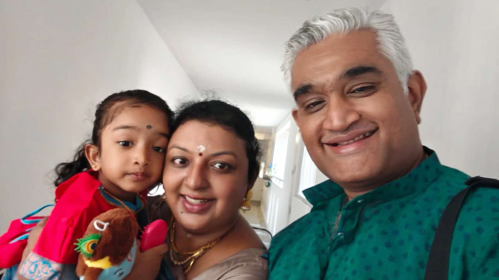 Parent Nithiyasri Subramaniam, her husband and daughter pose for a family ‘selfie’.