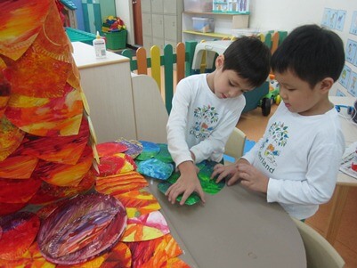 Children from Kinderland working on the art pieces