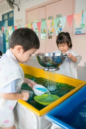 Provide ladles, scoops and a variety of containers for your child to play!