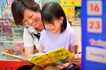 Teacher reading to child