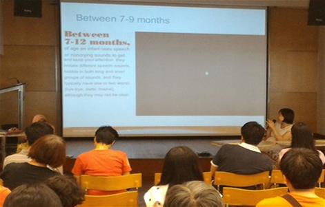 Ms Wong explaining developmental milestones