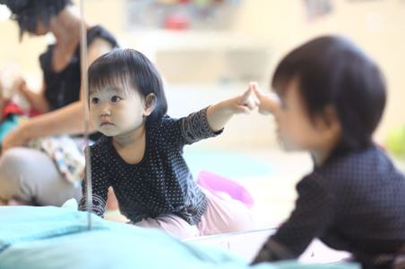 Babies love playing with mirrors!