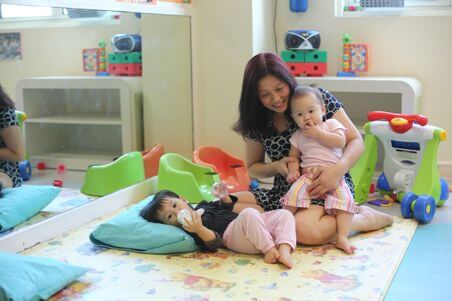 playroom with infants and teacher